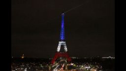 The Eiffel Tower is illuminated in the French national colors red, white and blue in honor of the victims of the terror attacks last Friday in Paris, Monday, Nov. 16, 2015.  France is urging its European partners to move swiftly to boost intelligence sharing, fight arms trafficking and terror financing, and strengthen border security in the wake of the Paris attacks. (AP Photo/Frank Augstein)