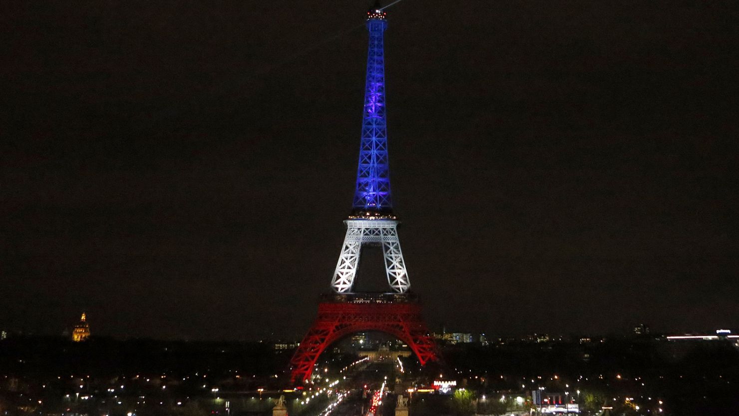 The Eiffel Tower is illuminated in the French national colors red, white and blue in honor of the victims of the terror attacks last Friday in Paris, Monday, Nov. 16, 2015.  France is urging its European partners to move swiftly to boost intelligence sharing, fight arms trafficking and terror financing, and strengthen border security in the wake of the Paris attacks. (AP Photo/Frank AugsteinAP)
