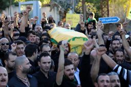 Mourners chant slogans at the funeral of Adel Termos.