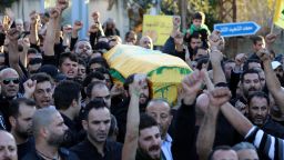 Mourners chant slogans as they carry the body of Adel Termos, who was killed in a twin bombing attack that rocked a busy shopping street in the area of Burj al-Barajneh in Beirut's southern suburb, during his funeral in the village of Tallussa in the Nabatiyeh governorate, south of Lebanon on November 13, 2015. Lebanon mourned 44 people killed in south Beirut in a twin bombing claimed by the Islamic State group, the bloodiest such attack in years, the Red Cross also said at least 239 people were also wounded, several in critical condition. AFP PHOTO / MAHMOUD ZAYYAT        (Photo credit should read MAHMOUD ZAYYAT/AFP/Getty Images)