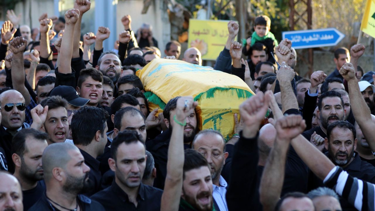 Mourners chant slogans at the funeral of Adel Termos.