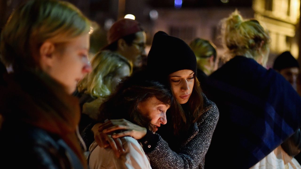 PARIS, FRANCE - NOVEMBER 16:  Members of the public view candles and tributes left opposite the main entrance of Bataclan concert hall as French police lift the cordon following Fridays terrorist attacks on November 16, 2015 in Paris, France. A Europe-wide one-minute silence was held at 12pm CET today in honour of at least 129 people who were killed last Friday in a series of terror attacks in the French capital.  (Photo by Jeff J Mitchell/Getty Images)