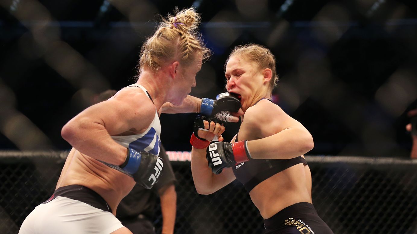 Holly Holm punches Ronda Rousey during their UFC title fight Sunday, November 15, in Melbourne. Holm knocked out the heavily favored Rousey in the second round. It was the first defeat of Rousey's career.