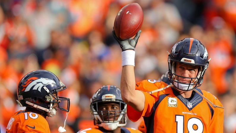 Denver Broncos quarterback Peyton Manning acknowledges the home crowd after he set the NFL record for career passing yards on Sunday, November 15. Brett Favre previously held the record (71,838 yards).