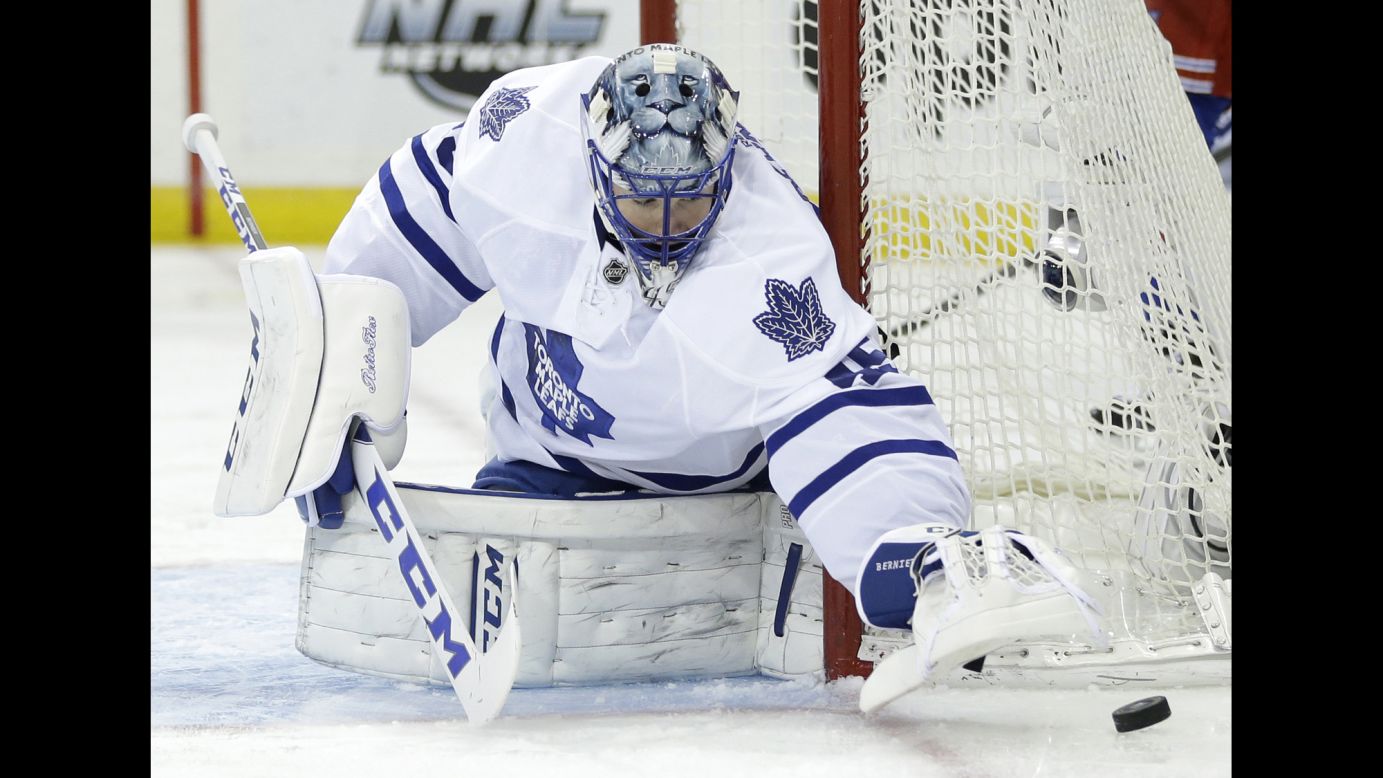 Toronto Maple Leafs goalie Jonathan Bernier covers the puck during an NHL game in New York on Sunday, November 15.