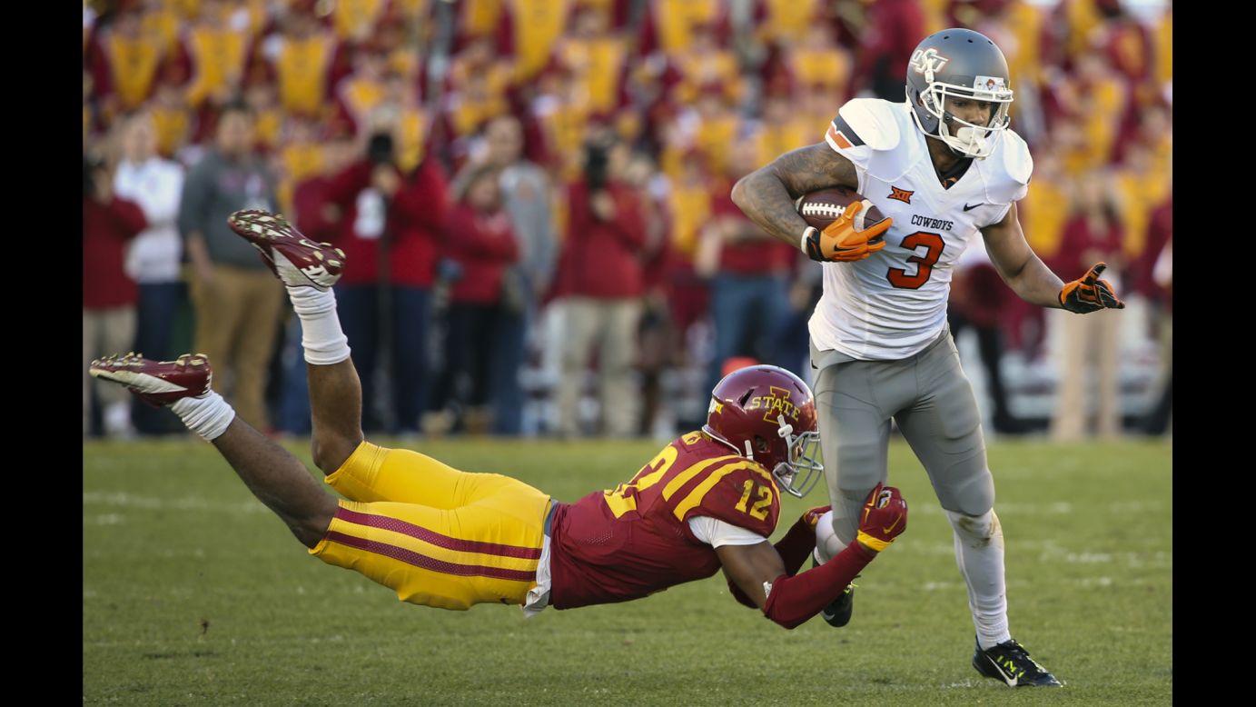 Oklahoma State wide receiver Marcell Ateman tries to get away from Iowa State's Jarnor Jones during a college football game Saturday, November 14, in Ames, Iowa. Ateman had eight catches for 132 yards and a touchdown as the Cowboys won 35-31 and improved their record to 10-0 this season.