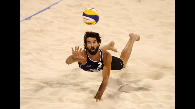 Turkish volleyball player Murat Giginoglu dives for a ball during the Qatar Open in Doha, Qatar, on Thursday, November 12.