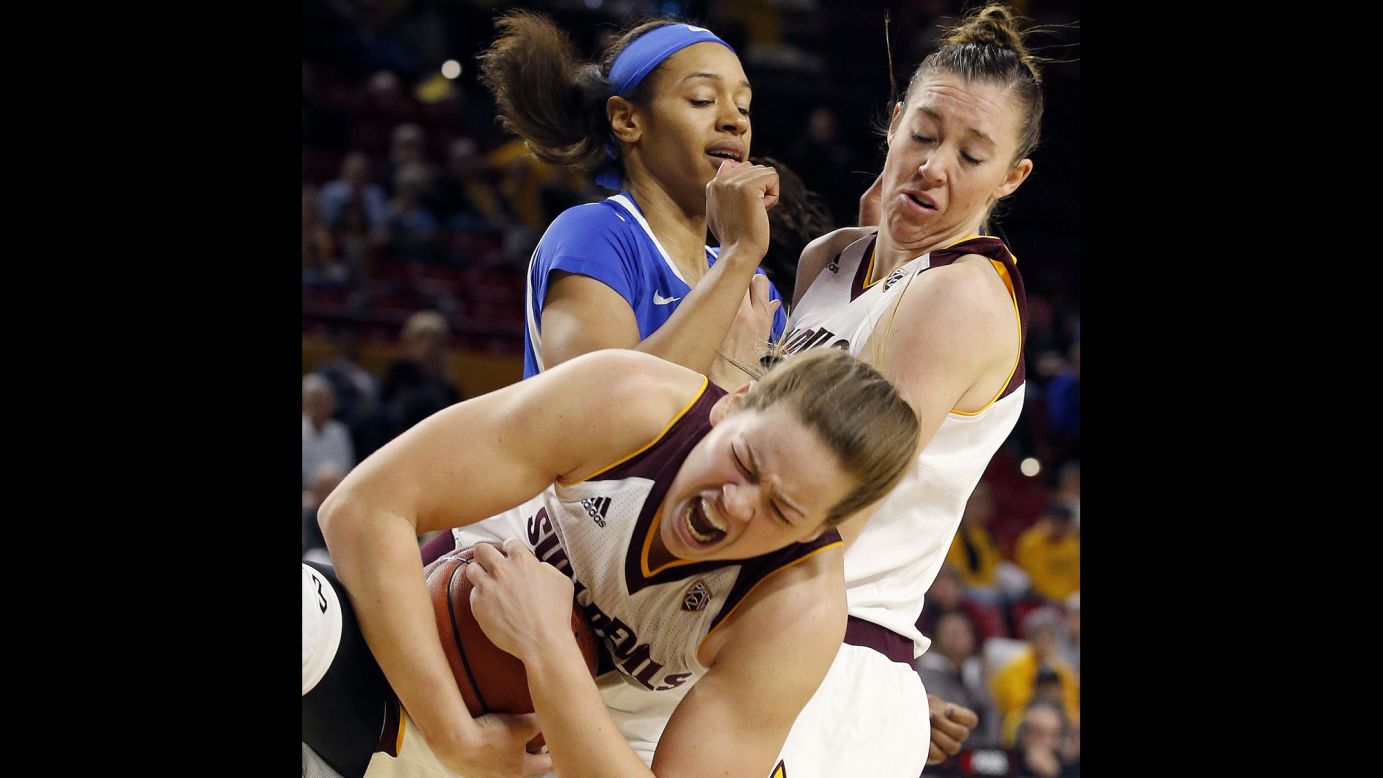 Arizona State's Sophie Brunner grabs a rebound as teammate Eliza Normen collides with Kentucky's Alexis Jennings during a game in Tempe, Arizona, on Sunday, November 15.