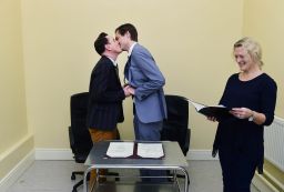 Newly married couple Richard Dowling and Cormac Gollogly kiss.