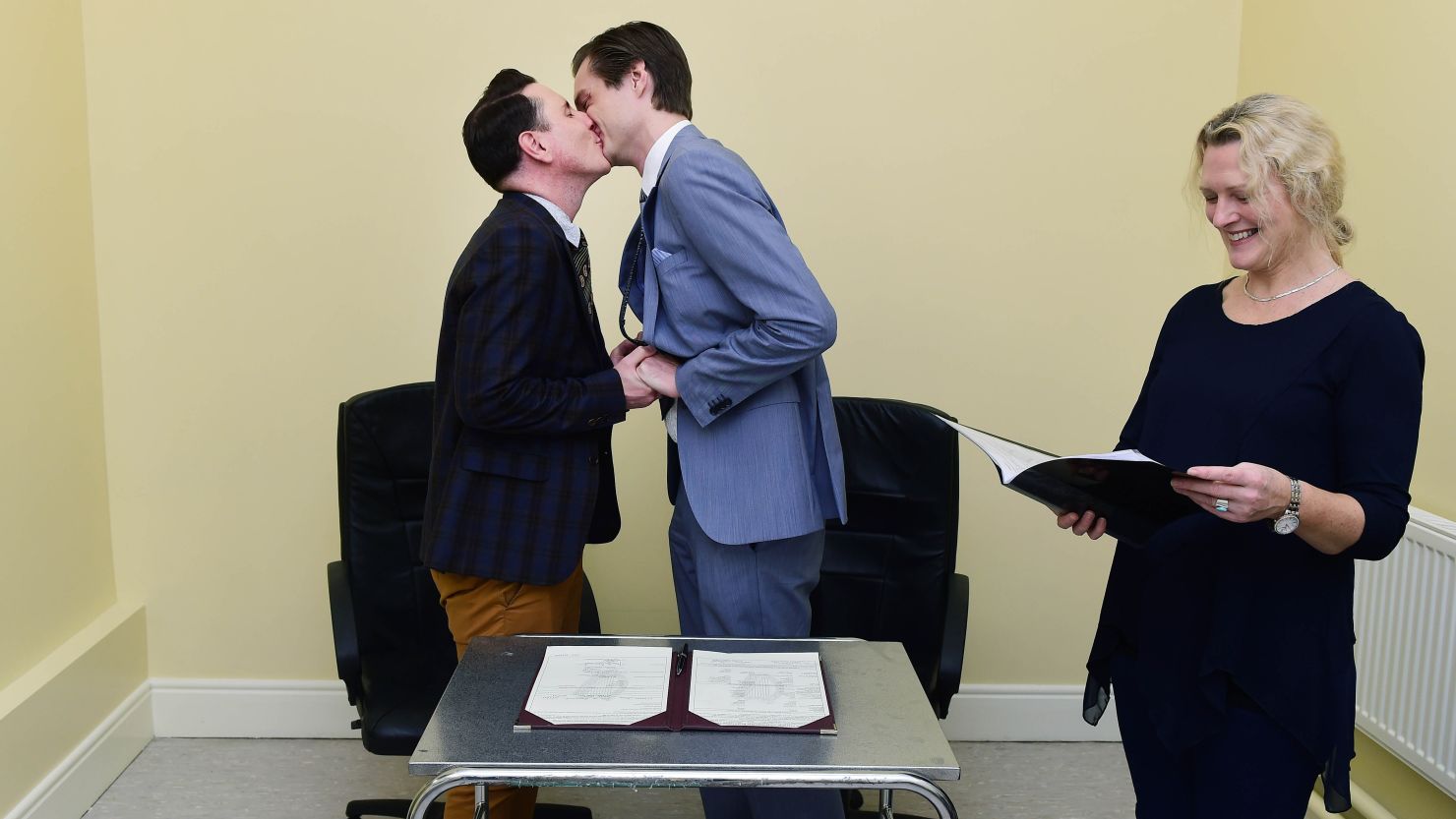 Richard Dowling, left, and Cormac Gollogly kiss after becoming the first same-sex couple to marry in Ireland on Tuesday, November 17.