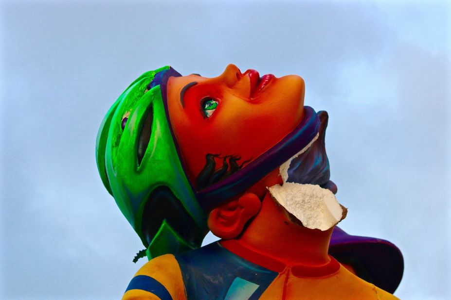 Large parade effigies are constructed from Styrofoam and vulnerable to both the elements and human interference. Some don't make it to the finish line, including this decapitated cyclist. 