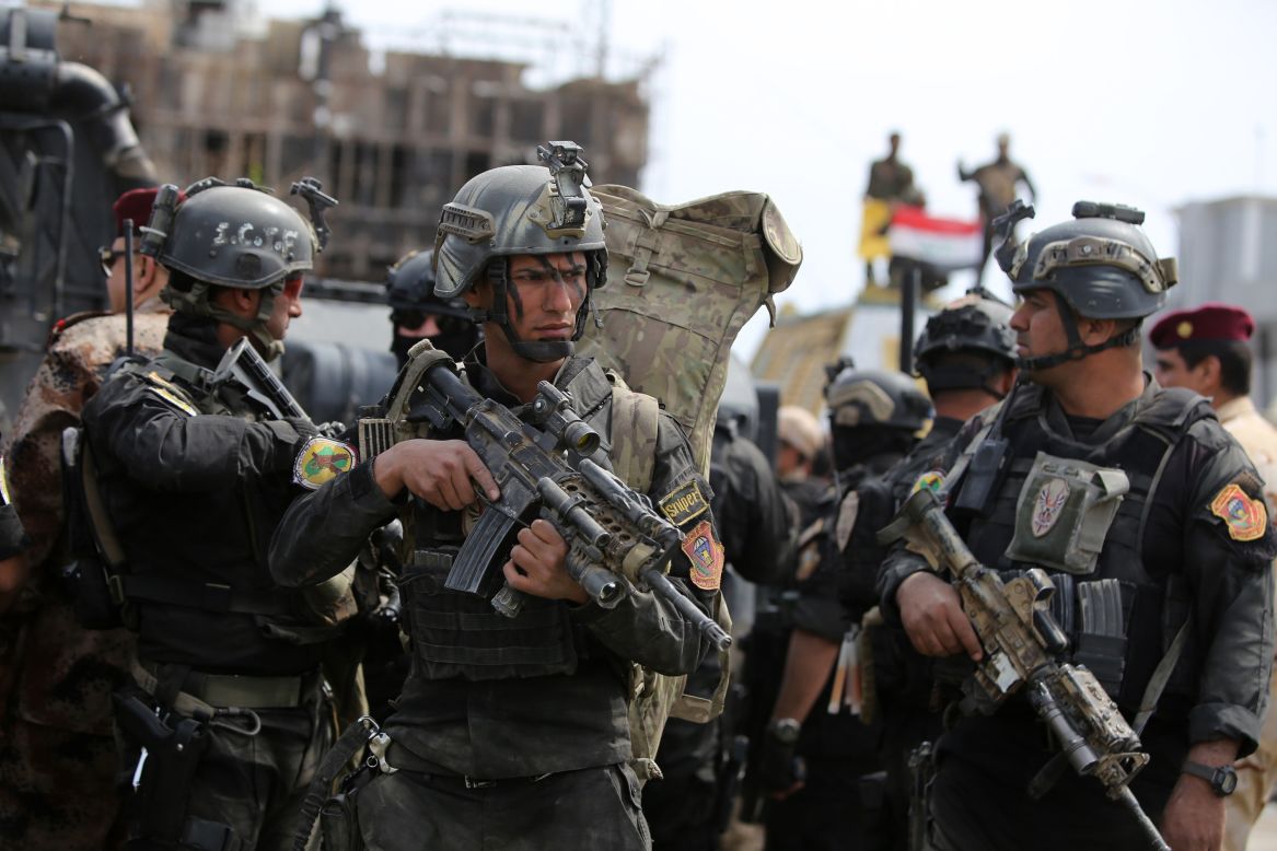 Iraqi counter-terrorism forces patrol a street in Tikrit in April 2015, a day after the country's prime minister declared victory in the battle to retake the city from ISIS. 