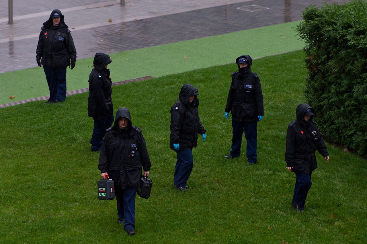 Police officers conduct searches of the area surrounding Wembley Stadium.