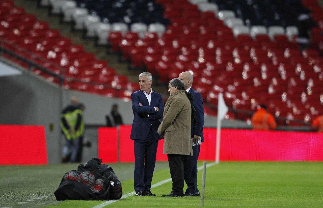France coach Didier Deschamps is pictured on the pitch before the start of the friendly.