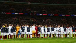 LONDON, ENGLAND - NOVEMBER 17:  Players pose for a moment of applause prior to the International Friendly match between England and France at Wembley Stadium on November 17, 2015 in London, England.  (Photo by Paul Gilham/Getty Images)