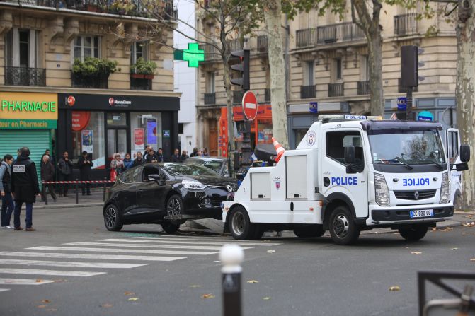 A Renault Clio with Belgian license plates is towed by the police in Paris on Tuesday, November 17. The car is believed to have been rented by <a target="_blank">Salah Abdeslam.</a><a target="_blank"> Authorities are looking for Abdeslam,</a> a Belgium-born French national who is one of three brothers suspected in the terror attacks.