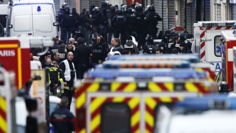 Police gather during the raid in Saint-Denis.