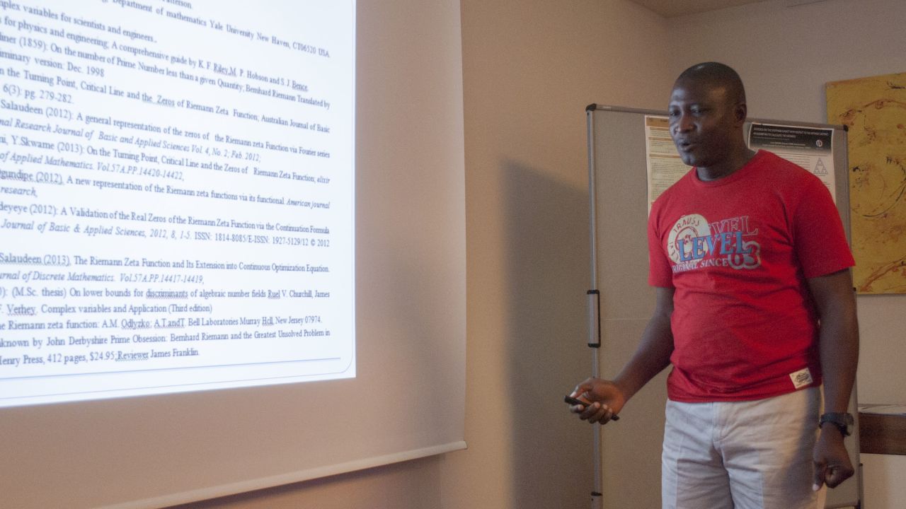 Opeyemi Enoch presenting his solution at the International Conference on Mathematics and Computer Science 2015, Vienna.