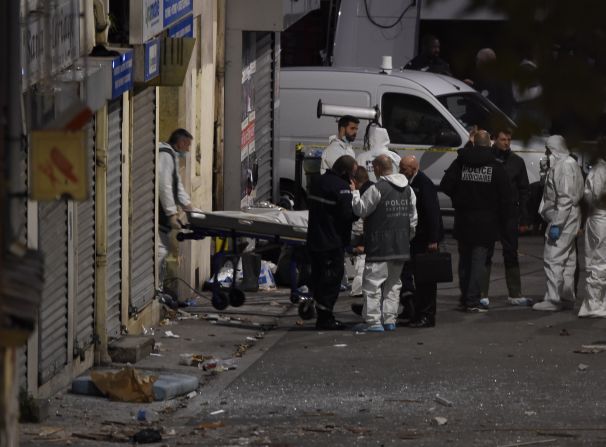 A body is removed from the building on November 18.