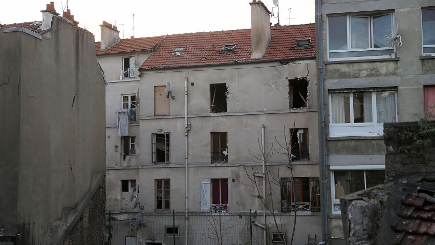 SAINT-DENIS, FRANCE - NOVEMBER 18:  The damaged building that was raided earlier in the morning is pictured on November 18, 2015 in Saint-Denis, France. French Police special forces raided an apartment, hunting those behind the attacks that claimed 129 lives in the French capital five days ago. At least one person was killed in an apartment targeted during the operation aimed at the suspected mastermind of the attacks, Belgian Abdelhamid Abaaoud. At least five police officers have been wounded in the shootout.  (Photo by Pierre Suu/Getty Images)