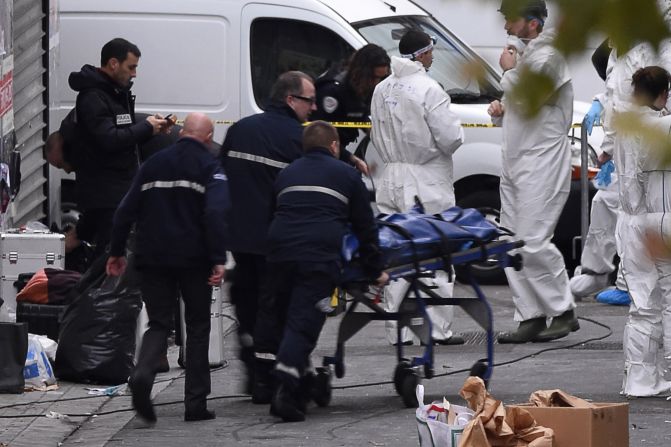 A body is removed from an apartment that was raided by police in the Paris suburb of Saint-Denis, France, on Wednesday, November 18. French special forces were looking for those behind the November 13 <a target="_blank">terrorist attacks in Paris.</a> The hourslong ordeal ended with at least two suspects dead and eight detained.