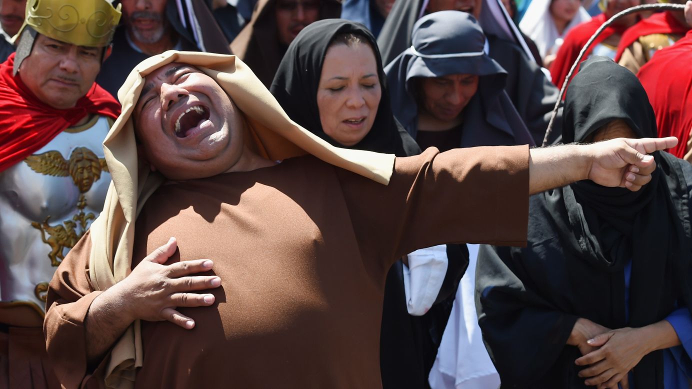 An actor laughs during a re-enactment of Jesus Christ's crucifixion Friday, April 3, in Los Angeles. The re-enactment was part of Good Friday festivities.
