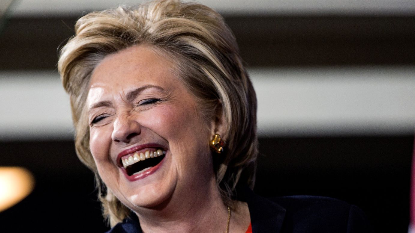 Democratic presidential candidate Hillary Clinton laughs before speaking to supporters at a Human Rights Campaign breakfast in Washington on Saturday, October 3.