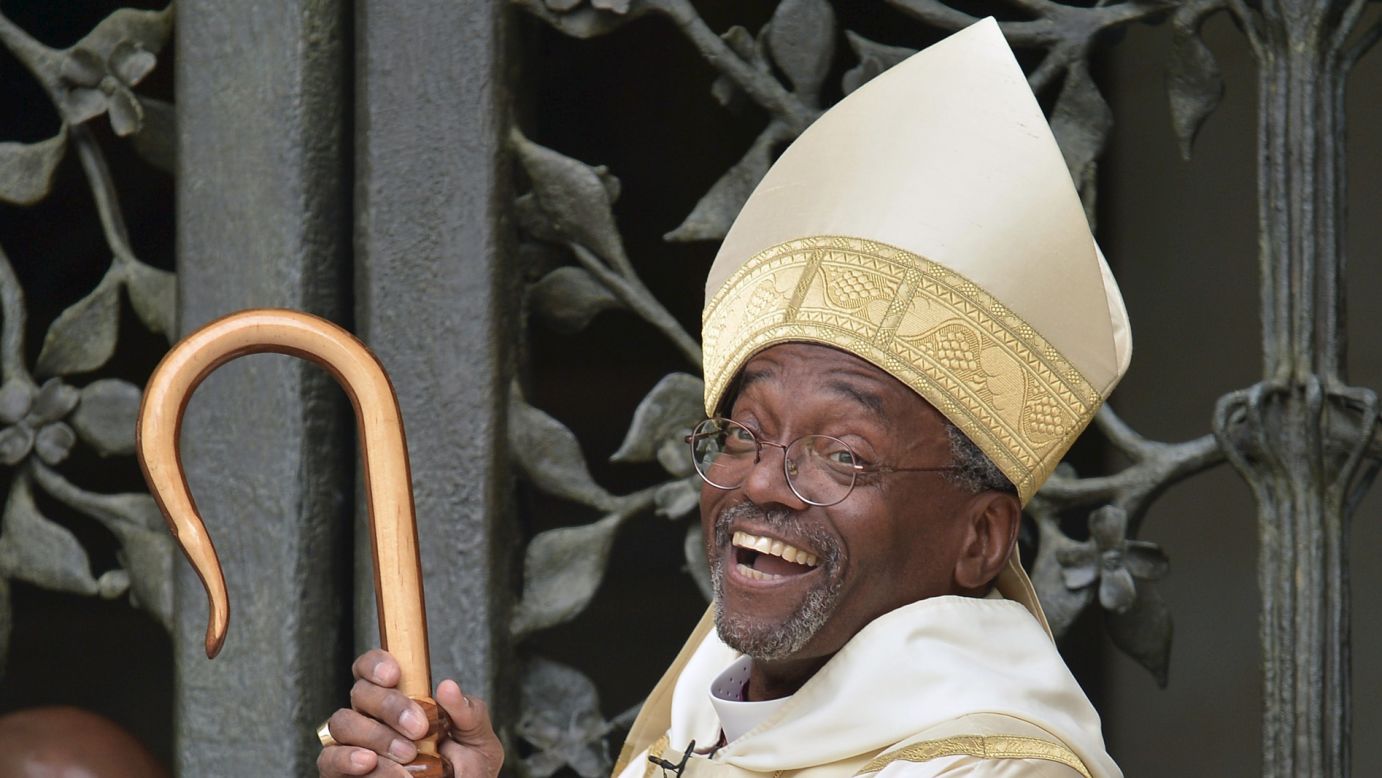 The Rev. Michael Bruce Curry laughs Sunday, November 1, as he waits for the traditional opening of the doors at the Washington National Cathedral. Curry became the first African-American to serve as presiding bishop of the Episcopal Church.