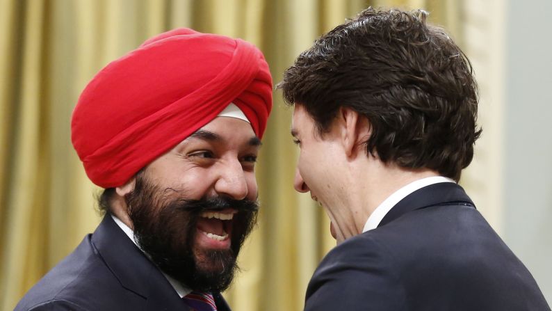Navdeep Bains, Canada's new minister of innovation, science and economic development, is congratulated on his appointment by Prime Minister Justin Trudeau, right, at Rideau Hall in Ottawa on Wednesday, November 4.