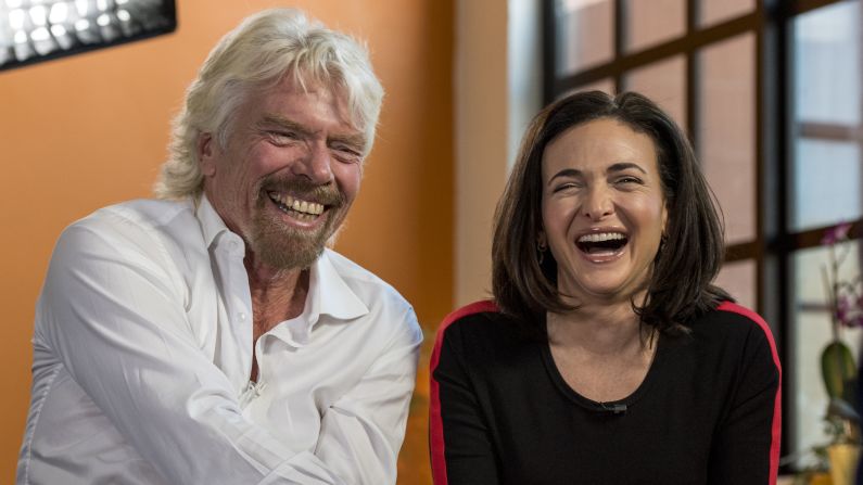 Virgin Group founder Richard Branson and Sheryl Sandberg, the chief operating officer of Facebook, have a laugh during a television interview in San Francisco on Thursday, April 23.
