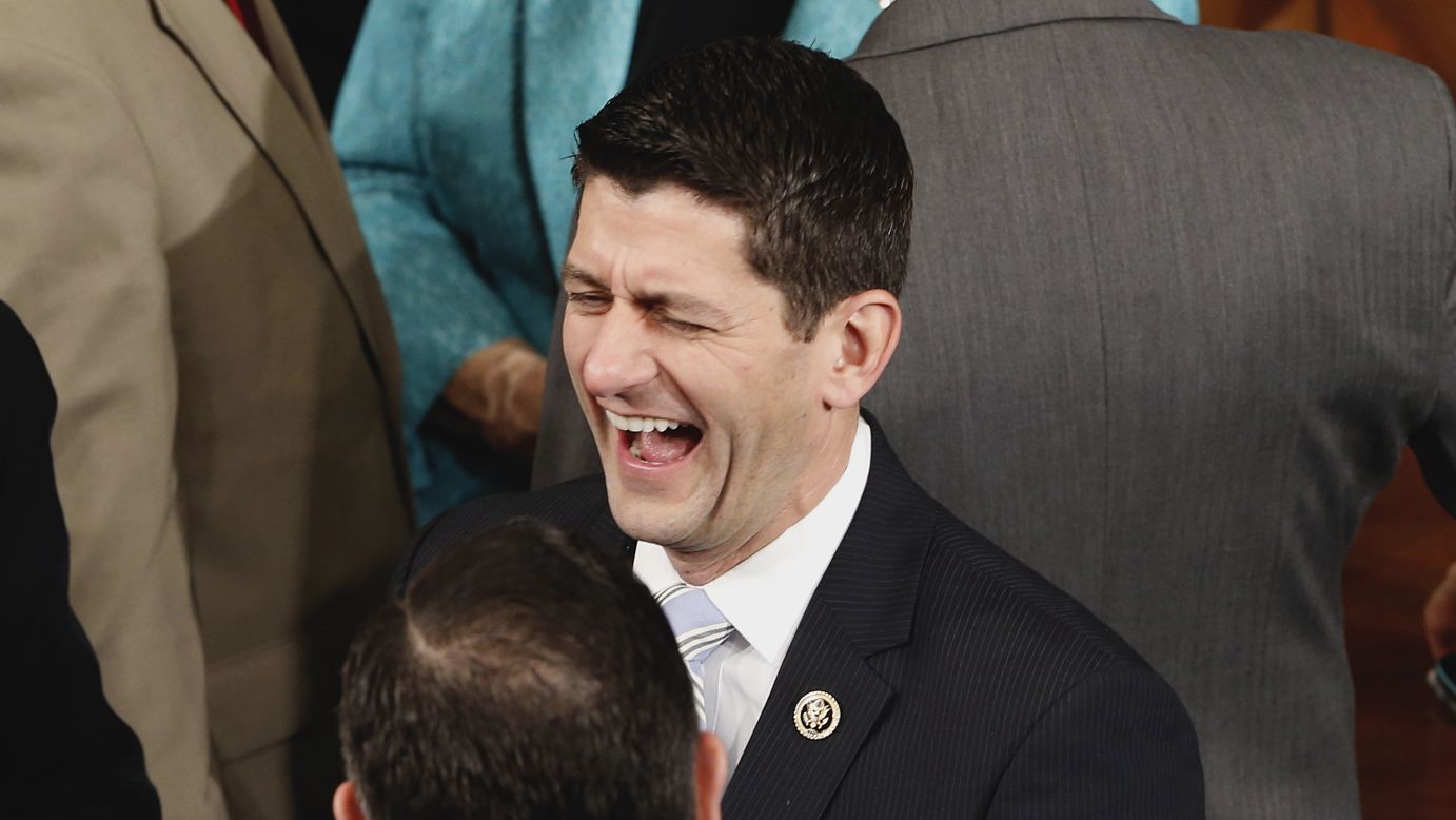 U.S. Rep. Paul Ryan, a Republican from Wisconsin, laughs with U.S. Sen Ted Cruz, foreground, during a joint meeting of Congress on Wednesday, April 29. Ryan became House Speaker later in the year.