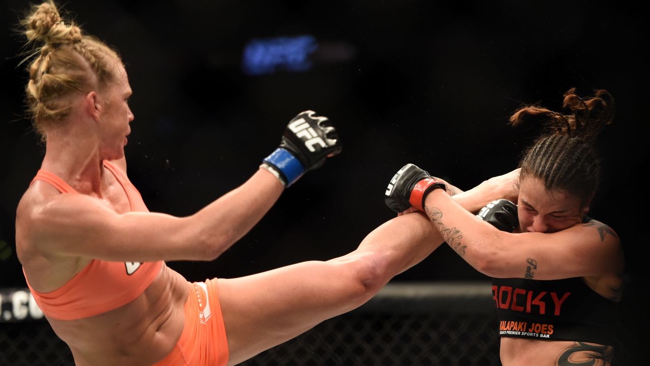 After more than a decade as a professional kickboxer and boxer, Holm switched full time to the more lucrative sport of mixed martial arts in 2013. Here, she kicks Raquel Pennington during a bantamweight bout February 28 in Los Angeles. Holm won the fight.