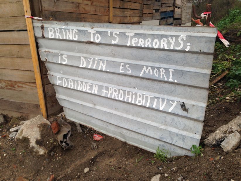 A newly erected, hand-written sign is found at the entrance to the site: Terrorists, it warns in broken English, are forbidden to enter.