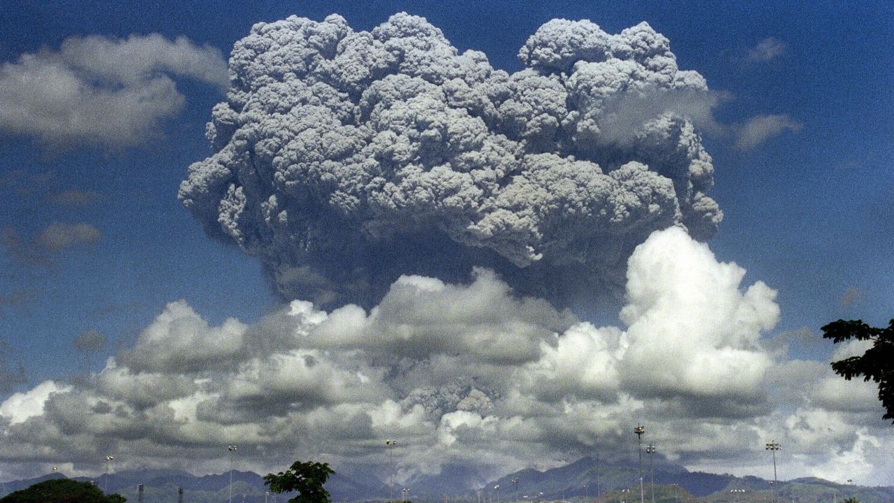 A giant mushroom cloud of steam and ash exploding out of Mount Pinatubo volcano during its eruption in 1991.