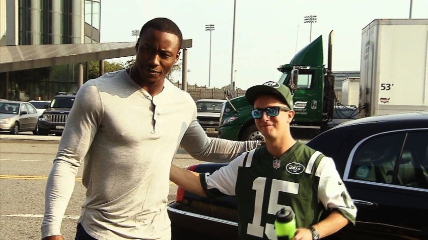 Brandon Marshall, wide receiver for the New York Jets, poses for a picture with Daniel Lewis, an Omaze contest winner.