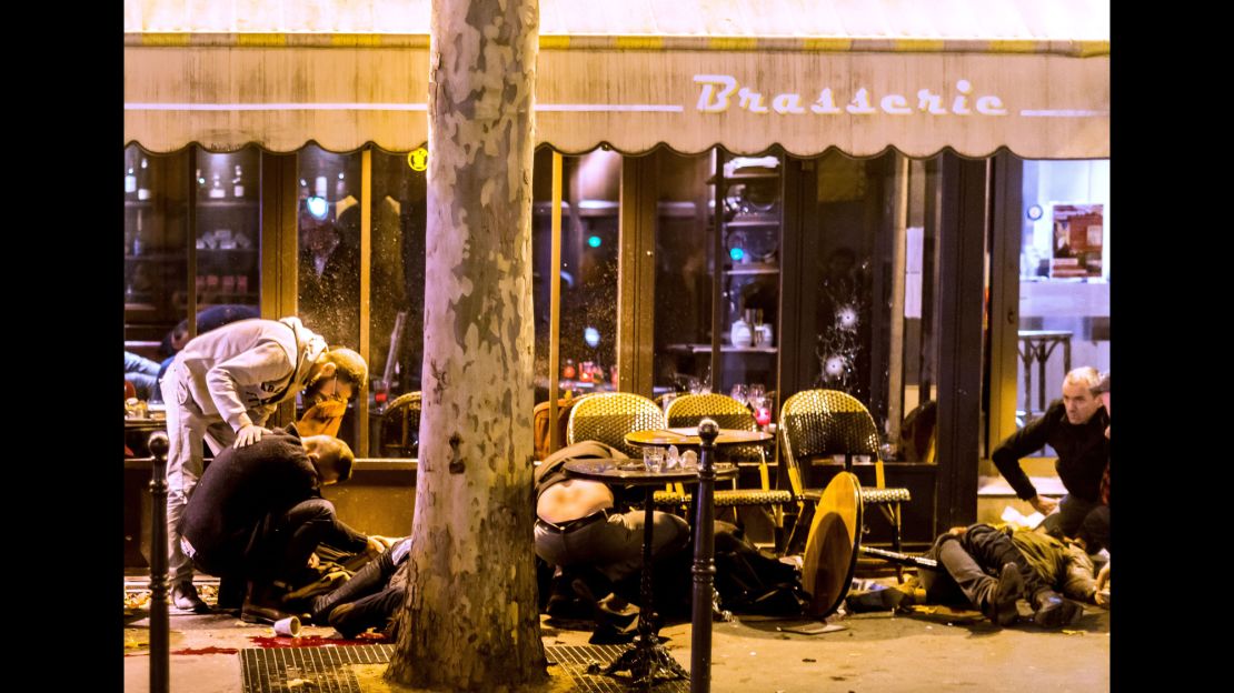 People tend to victims outside Café Bonne Bière.