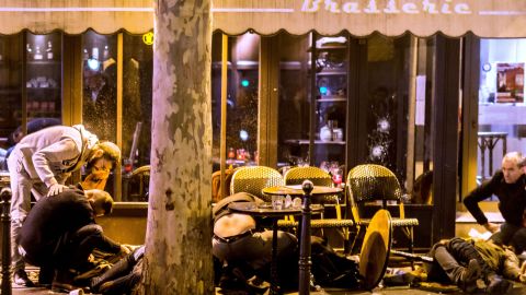 People tend to victims outside Café Bonne Bière.
