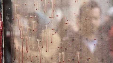 Bloodstains remain on windows in Paris' 11th Arrondissement.