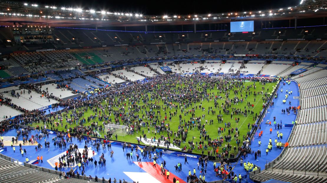 Spectators invade the Stade de France field after the match.