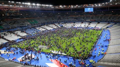Spectators invade the Stade de France field after the match.