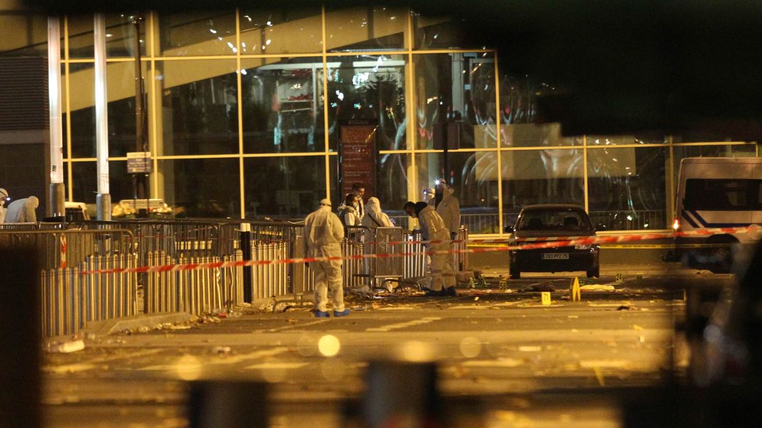 Police work outside the Stade de France after the explosions.