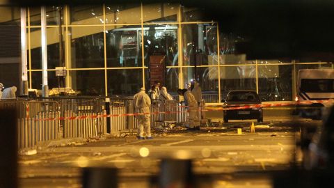 Police work outside the Stade de France after the explosions.