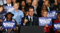 Connecticut Governor Dan Malloy speaks moments before U.S. President Barack Obama   comes out to speak in support of him on November 2, 2014 in Bridgeport, Connecticut. On the weekend before Election Day the president is trying to energize the Democratic base to get out and vote. Polls show a tight race in many states with most analysts predicting that the Republicans are on track to make gains and possibly control the U.S. Senate. Malloy is currently in a dead heat with Republican Tom Foley.  (Photo by Spencer Platt/Getty Images)