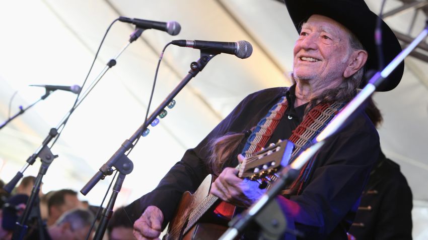 WEST HOLLYWOOD, CA - APRIL 13:  Musican Willie Nelson performs at the John Varvatos 11th Annual Stuart House Benefit presented by Chrysler, Kids Tent by by Hasbro at John Varvatos Boutique on April 13, 2014 in West Hollywood, California.  (Photo by Rachel Murray/Getty Images for John Varvatos)