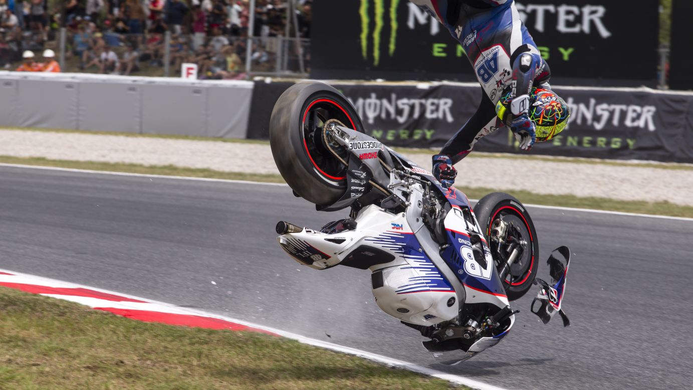 Czech motorcycle racer Karel Abraham crashes while practicing for the MotoGP event in Barcelona, Spain, on Saturday, June 13. His injuries kept him out of several races this season, but he eventually returned to competition.