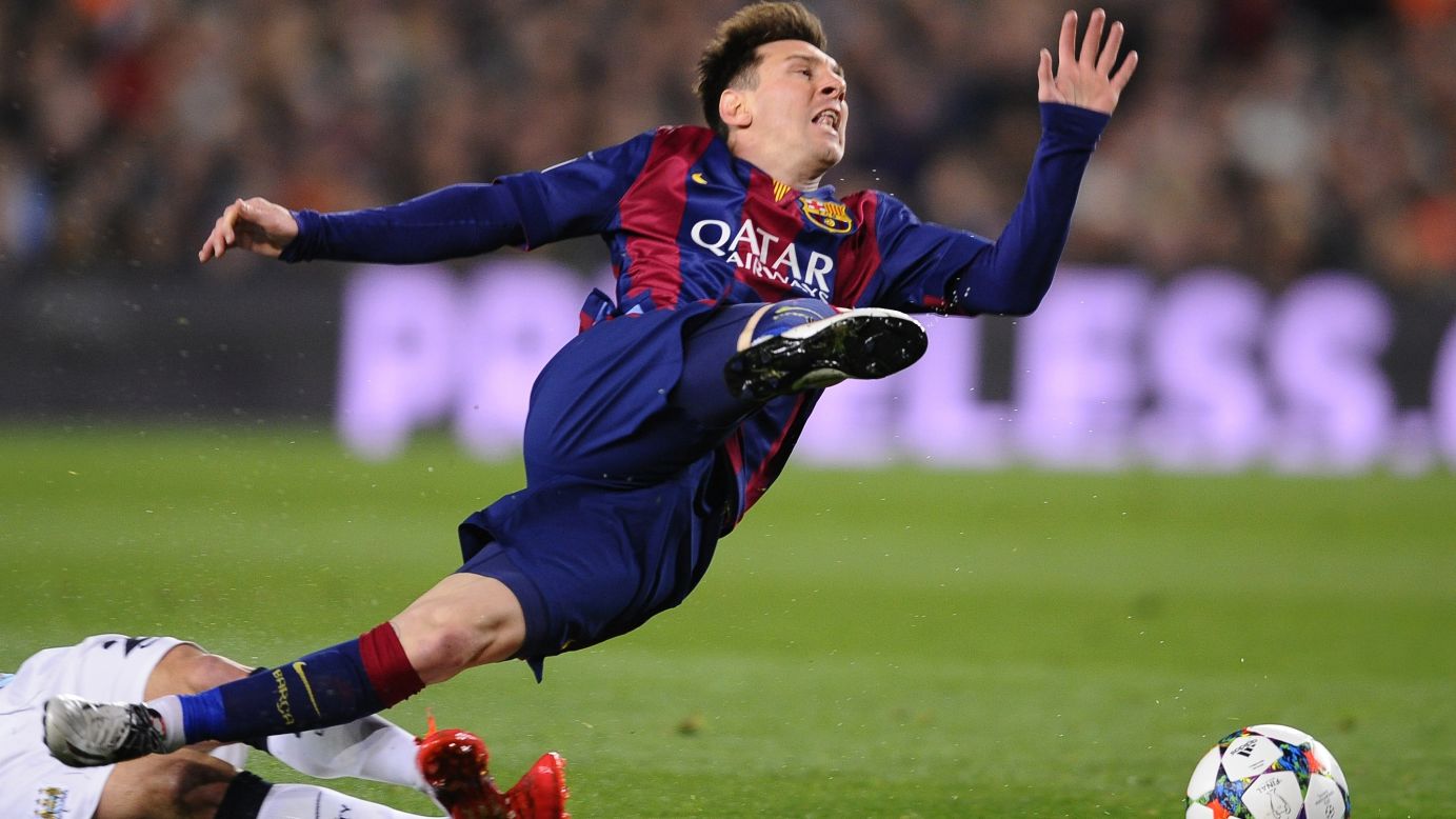 Barcelona's Lionel Messi is tripped during a Champions League game against Manchester City on Wednesday, March 18. Barcelona won the match 2-1 and advanced to the quarterfinals of the European tournament, which it ended up winning in June. It was the Spanish club's <a href="http://www.cnn.com/2015/06/06/football/champions-league-juventus-barcelona/" target="_blank">fifth European title</a> and its first since 2011.