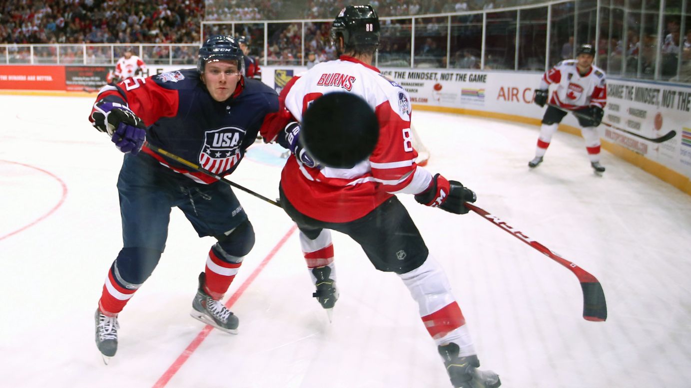 U.S. hockey player Matt Williams watches the puck hit the glass during an exhibition game against Canada on Saturday, June 6. The exhibition series, the Ice Hockey Classic, took place in Australia.