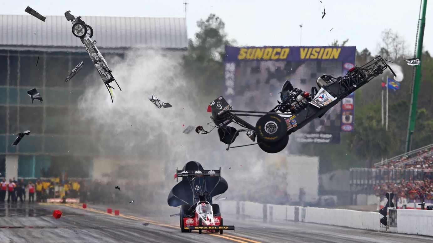 The car of drag racer Larry Dixon goes airborne during the Gatornationals event in Gainesville, Florida, on Saturday, March 14. The car broke in half, but Dixon walked away from the incident.