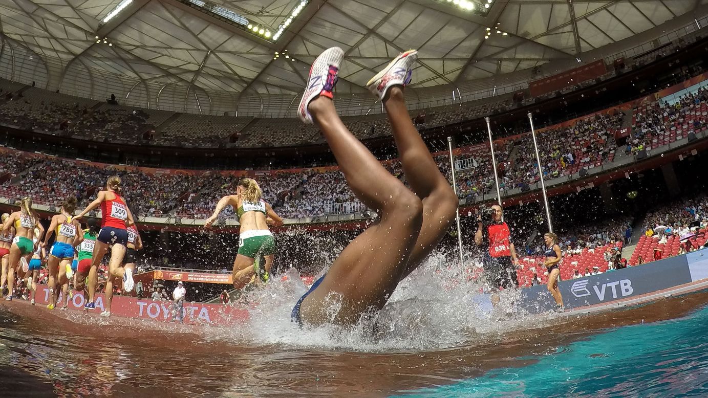 Panama's Rolanda Bell falls headfirst into the water during a steeplechase race at the World Championships in Beijing on Monday, August 24. She got up quickly and finished the race.