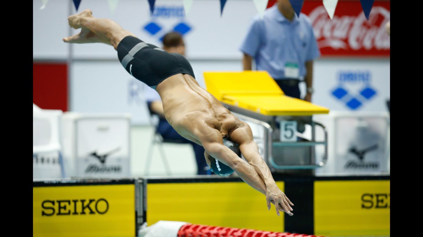 Japanese swimmer Hiromasa Fujimori dives into the water Sunday, February 22, starting an individual medley race at the Konami Open in Tokyo.